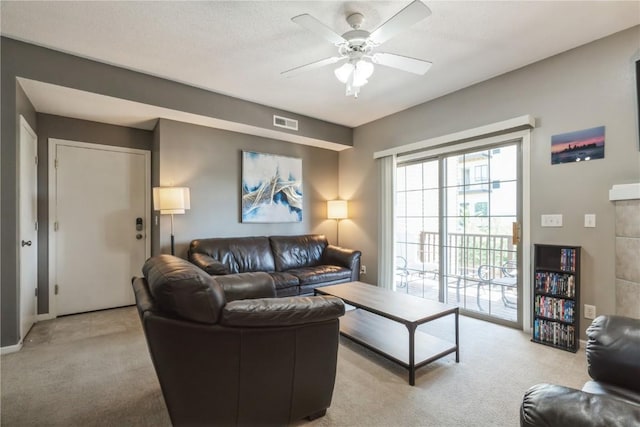 3028 Center Point Rd NE Unit 201, Cedar Rapids, IA 52402 - living area with light carpet and ceiling fan