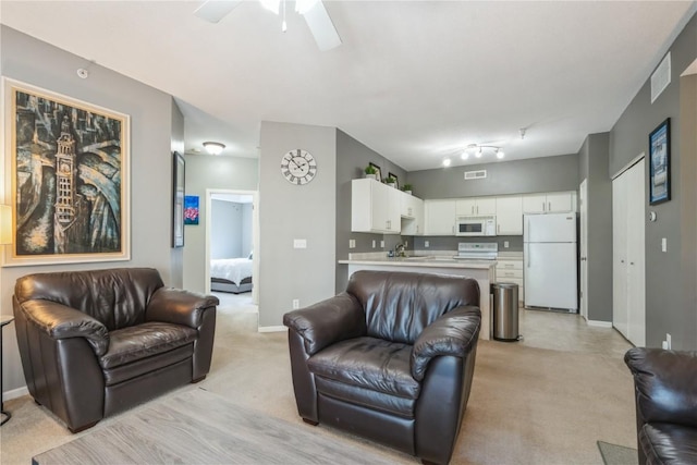 3028 Center Point Rd NE Unit 201, Cedar Rapids, IA 52402 - living area with light colored carpet and a ceiling fan