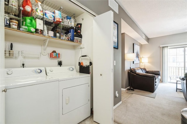 3028 Center Point Rd NE Unit 201, Cedar Rapids, IA 52402 - laundry area with washer and dryer and light carpet