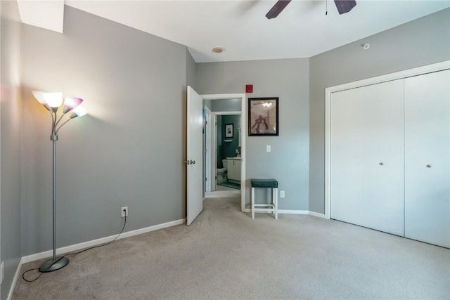 3028 Center Point Rd NE Unit 201, Cedar Rapids, IA 52402 - unfurnished bedroom with light carpet, a closet, and ceiling fan