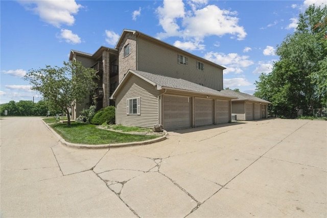 3028 Center Point Rd NE Unit 201, Cedar Rapids, IA 52402 - view of home's exterior featuring a garage and driveway