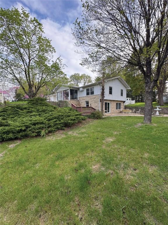 1852 215th St, Manchester, IA 52057 - view of green lawn with a deck