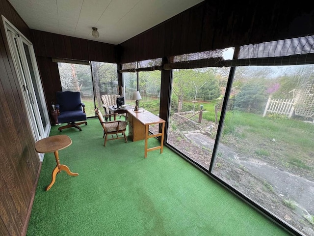 1852 215th St, Manchester, IA 52057 - sunroom featuring carpet flooring and wooden walls