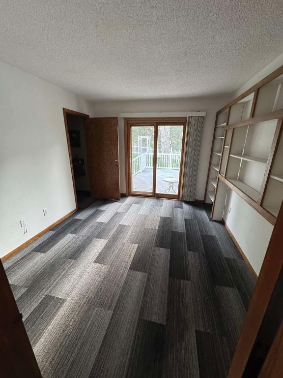 1852 215th St, Manchester, IA 52057 - unfurnished room with a textured ceiling