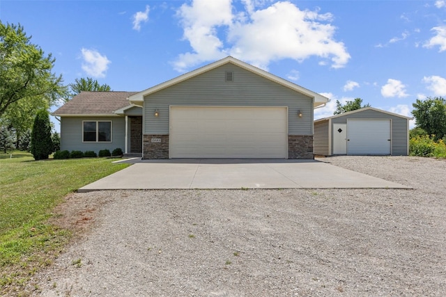 2089 117th Ct, Kalona, IA 52247 - view of front facade featuring a front yard and an outdoor structure