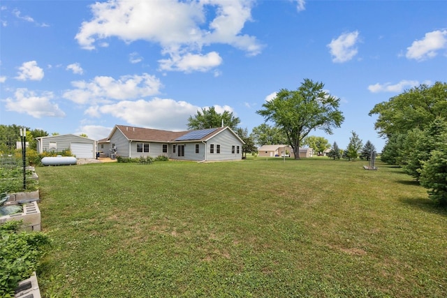 2089 117th Ct, Kalona, IA 52247 - view of green lawn featuring an outdoor structure