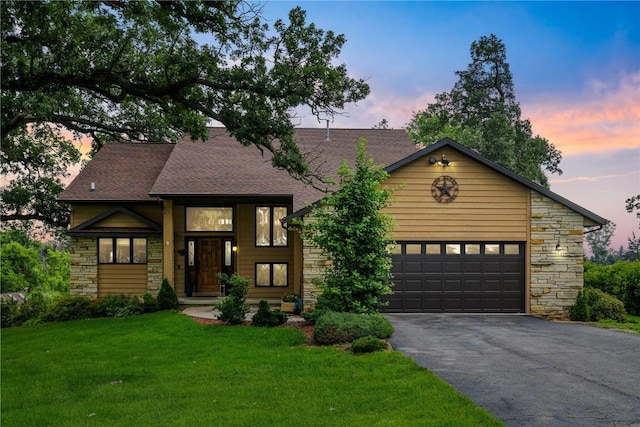 5524 Cimarron Ct, Marion, IA 52302 - view of front of house featuring stone siding, driveway, a yard, and a garage