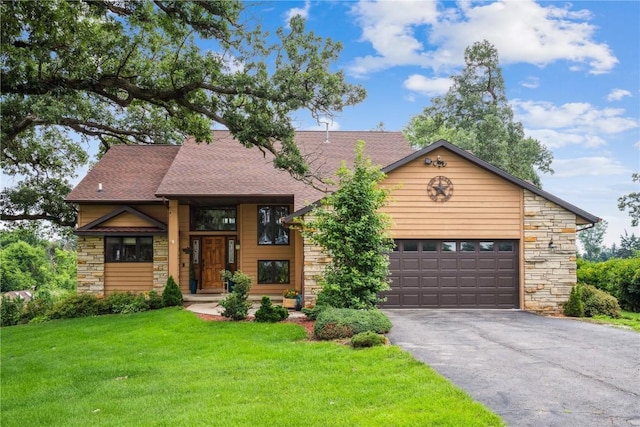 5524 Cimarron Ct, Marion, IA 52302 - view of front of home with stone siding, asphalt driveway, a shingled roof, and a front yard