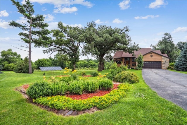 5524 Cimarron Ct, Marion, IA 52302 - view of grassy yard featuring asphalt driveway and an attached garage