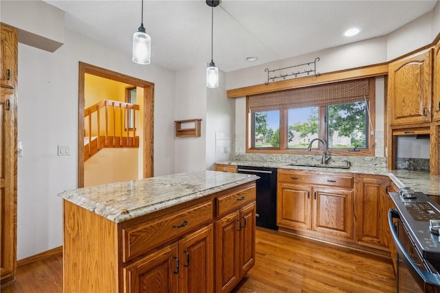 5524 Cimarron Ct, Marion, IA 52302 - kitchen with dishwasher, stainless steel range, light wood-style floors, light stone counters, and recessed lighting