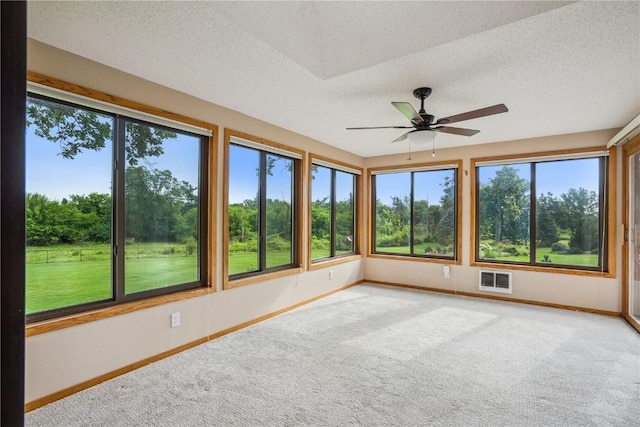 5524 Cimarron Ct, Marion, IA 52302 - unfurnished sunroom with plenty of natural light, carpet, and a textured ceiling