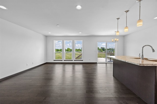 1921 Bowstring Dr, Marion, IA 52302 - unfurnished living room with dark wood-type flooring, a chandelier, and recessed lighting