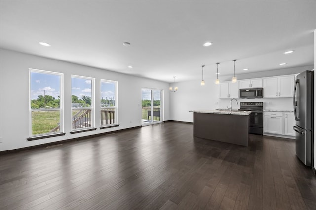 1921 Bowstring Dr, Marion, IA 52302 - living area with dark wood-type flooring, recessed lighting, and a chandelier