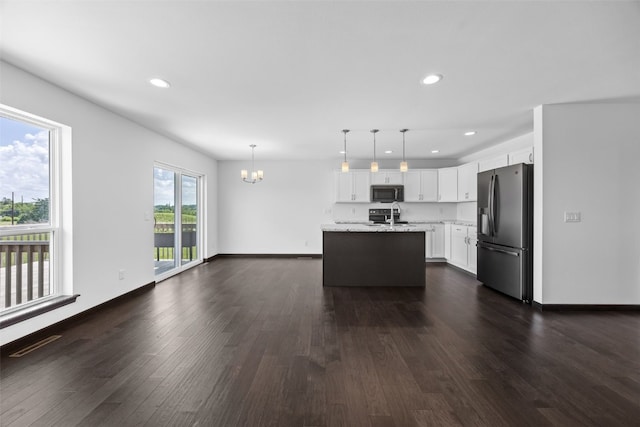 1921 Bowstring Dr, Marion, IA 52302 - kitchen featuring stainless steel fridge with ice dispenser, a chandelier, recessed lighting, and dark wood-type flooring
