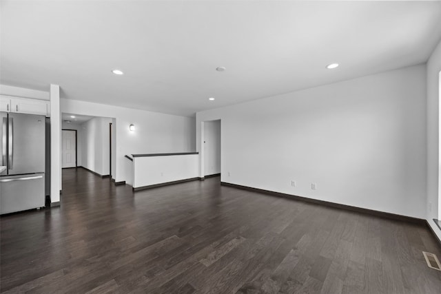 1921 Bowstring Dr, Marion, IA 52302 - unfurnished living room with dark wood-style floors and recessed lighting