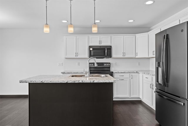 1921 Bowstring Dr, Marion, IA 52302 - kitchen with stainless steel appliances, recessed lighting, dark wood finished floors, white cabinetry, and light stone countertops
