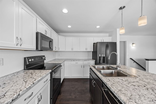 1921 Bowstring Dr, Marion, IA 52302 - kitchen featuring black appliances, white cabinets, dark wood-type flooring, decorative light fixtures, and recessed lighting