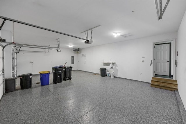 1921 Bowstring Dr, Marion, IA 52302 - garage featuring a garage door opener and electric panel
