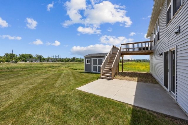 1921 Bowstring Dr, Marion, IA 52302 - view of green lawn with a shed, a patio, stairs, and a deck
