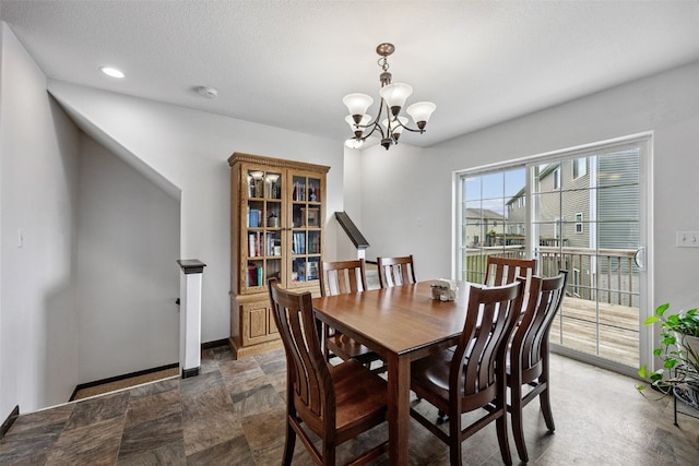 121 Woodstone Ln SW, Cedar Rapids, IA 52404 - dining area featuring a chandelier, stone finish floors, and recessed lighting