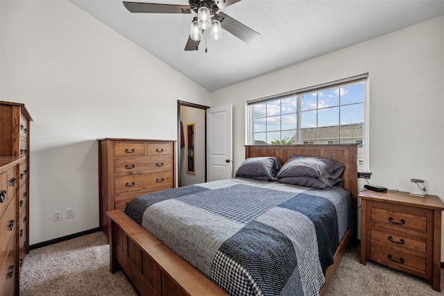 121 Woodstone Ln SW, Cedar Rapids, IA 52404 - bedroom featuring light carpet, vaulted ceiling, and a ceiling fan
