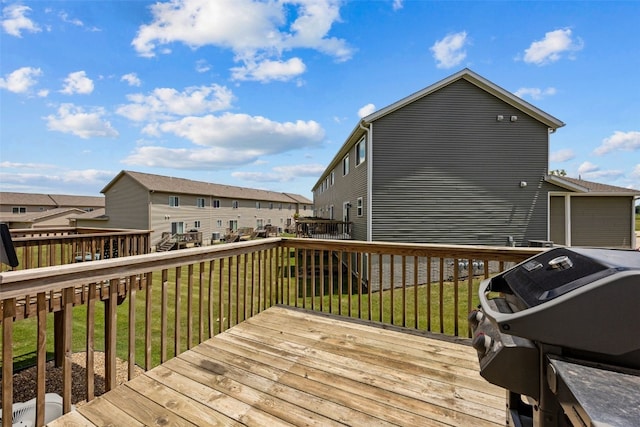 121 Woodstone Ln SW, Cedar Rapids, IA 52404 - deck featuring grilling area, a lawn, and a residential view
