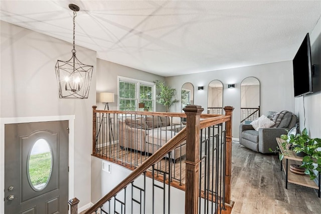 6808 Kelburn Ln NE, Cedar Rapids, IA 52402 - foyer with wood finished floors and a chandelier