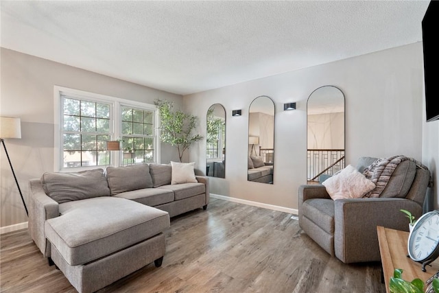 6808 Kelburn Ln NE, Cedar Rapids, IA 52402 - living room with wood finished floors and a textured ceiling