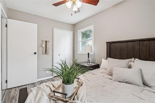 6808 Kelburn Ln NE, Cedar Rapids, IA 52402 - bedroom featuring wood finished floors, a closet, and a ceiling fan