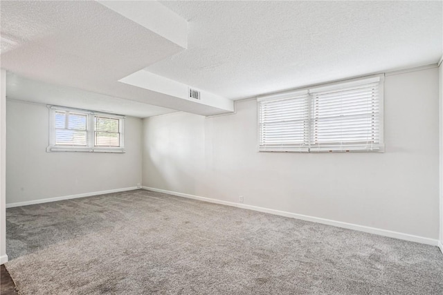 6808 Kelburn Ln NE, Cedar Rapids, IA 52402 - empty room featuring a textured ceiling and carpet flooring