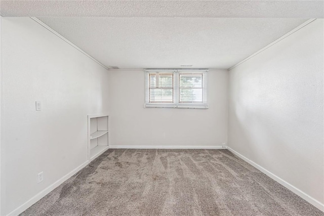 6808 Kelburn Ln NE, Cedar Rapids, IA 52402 - carpeted empty room with a textured ceiling and ornamental molding