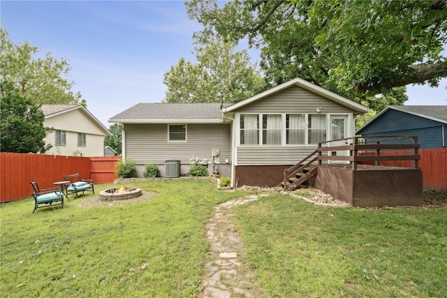 6808 Kelburn Ln NE, Cedar Rapids, IA 52402 - back of property featuring a fire pit, stairs, and a sunroom