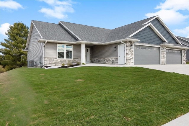 468 Chamber Dr, Anamosa, IA 52205 - craftsman-style home with an attached garage, stone siding, a front lawn, and driveway