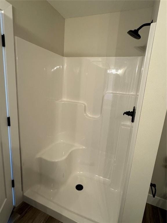 468 Chamber Dr, Anamosa, IA 52205 - full bathroom featuring wood finished floors and walk in shower