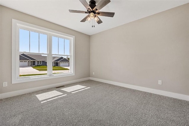 468 Chamber Dr, Anamosa, IA 52205 - empty room with carpet floors and a ceiling fan