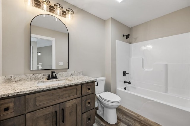 468 Chamber Dr, Anamosa, IA 52205 - bathroom featuring wood finished floors, vanity, and washtub / shower combination