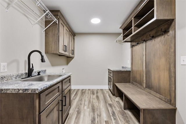 468 Chamber Dr, Anamosa, IA 52205 - laundry area with cabinet space, light wood-type flooring, and washer hookup