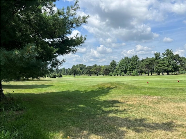 468 Chamber Dr, Anamosa, IA 52205 - view of community featuring a yard, view of golf course, and view of scattered trees