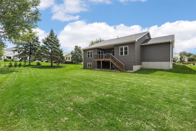 4310 Carpenter Rd NE, Cedar Rapids, IA 52411 - rear view of property with stairs, a wooden deck, and a yard