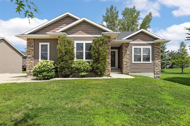 4310 Carpenter Rd NE, Cedar Rapids, IA 52411 - view of front facade featuring a front yard and stone siding