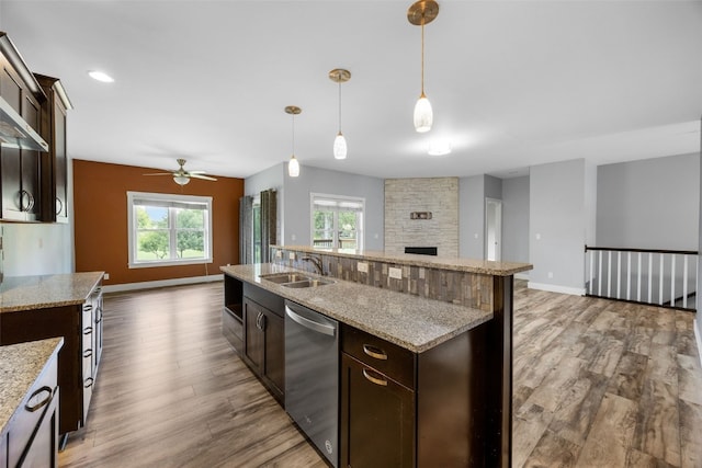 4310 Carpenter Rd NE, Cedar Rapids, IA 52411 - kitchen featuring dishwasher, open floor plan, a ceiling fan, and dark brown cabinetry