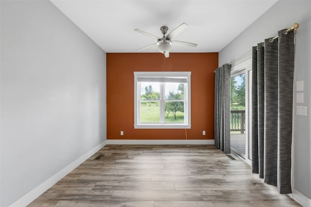 4310 Carpenter Rd NE, Cedar Rapids, IA 52411 - empty room featuring a ceiling fan and wood finished floors
