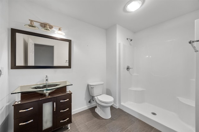 4310 Carpenter Rd NE, Cedar Rapids, IA 52411 - full bathroom with vanity, a shower, and wood finish floors