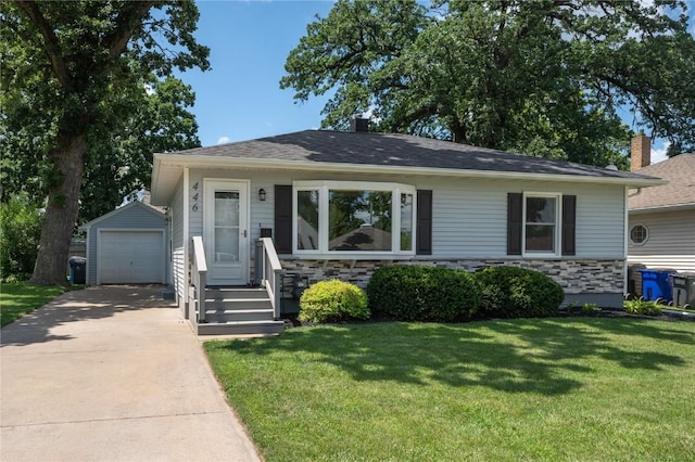 446 19th NW, Cedar Rapids, IA 52405 - view of front of house featuring stone siding, an outbuilding, driveway, a garage, and a front lawn