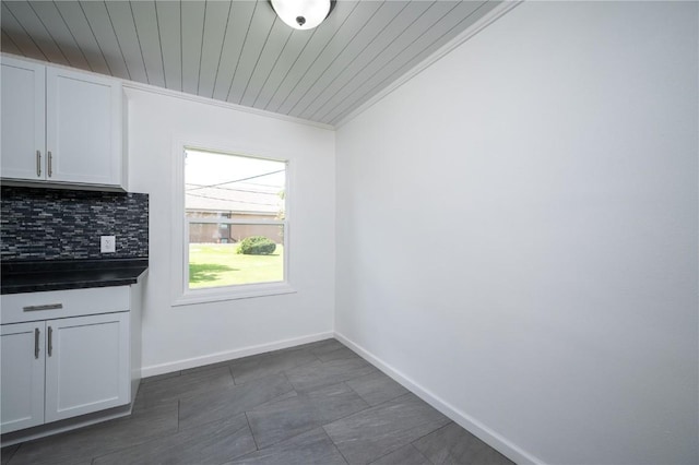 446 19th NW, Cedar Rapids, IA 52405 - unfurnished dining area featuring crown molding and wooden ceiling