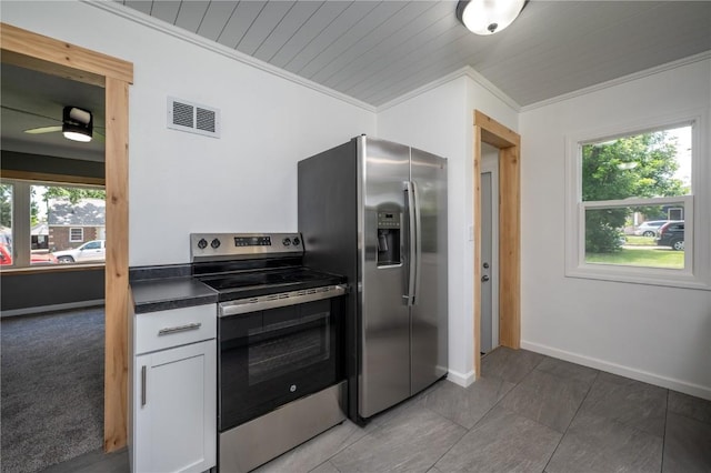 446 19th NW, Cedar Rapids, IA 52405 - kitchen featuring appliances with stainless steel finishes, crown molding, dark countertops, plenty of natural light, and ceiling fan