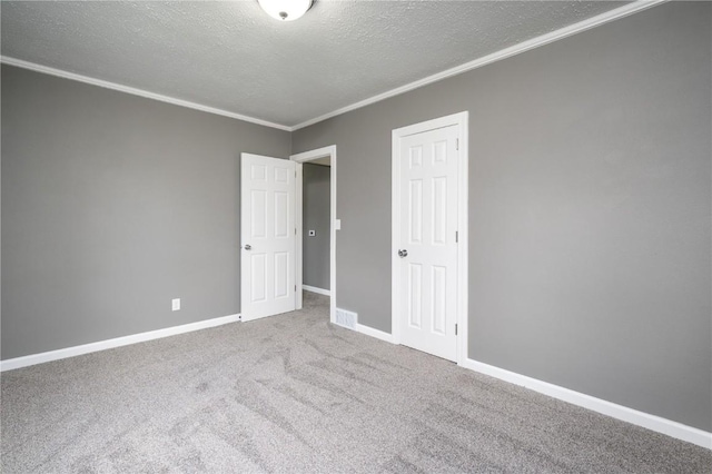446 19th NW, Cedar Rapids, IA 52405 - unfurnished bedroom featuring a textured ceiling, crown molding, carpet flooring, and a closet
