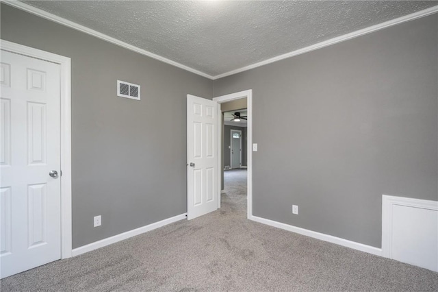 446 19th NW, Cedar Rapids, IA 52405 - unfurnished bedroom with carpet floors, a textured ceiling, and crown molding
