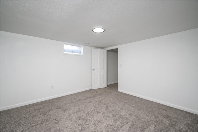 446 19th NW, Cedar Rapids, IA 52405 - below grade area featuring carpet flooring and a textured ceiling