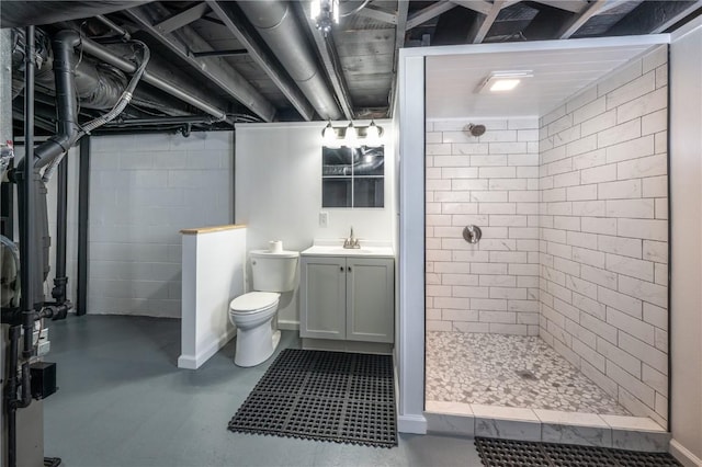 446 19th NW, Cedar Rapids, IA 52405 - bathroom with a tile shower, vanity, and concrete flooring